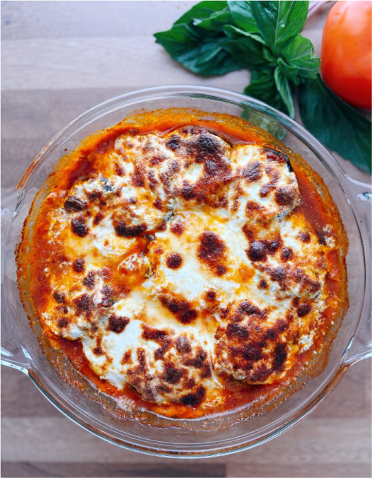 Baked no-noodle eggplant zucchini lasagna with spinach, ricotta, and marinara, golden and bubbly in a casserole dish.